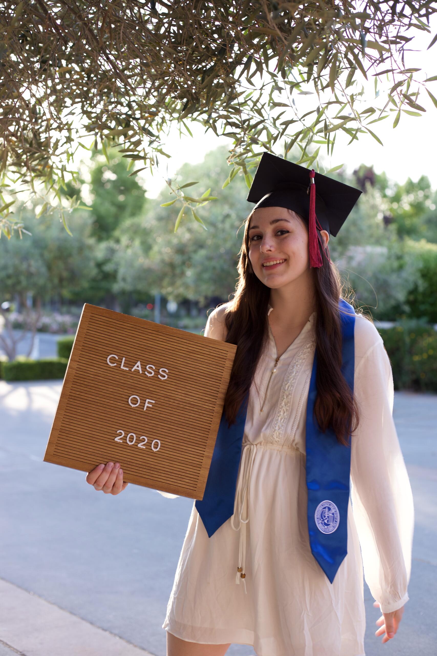 Graduate study abroad concept : Graduation cap on calendar paper